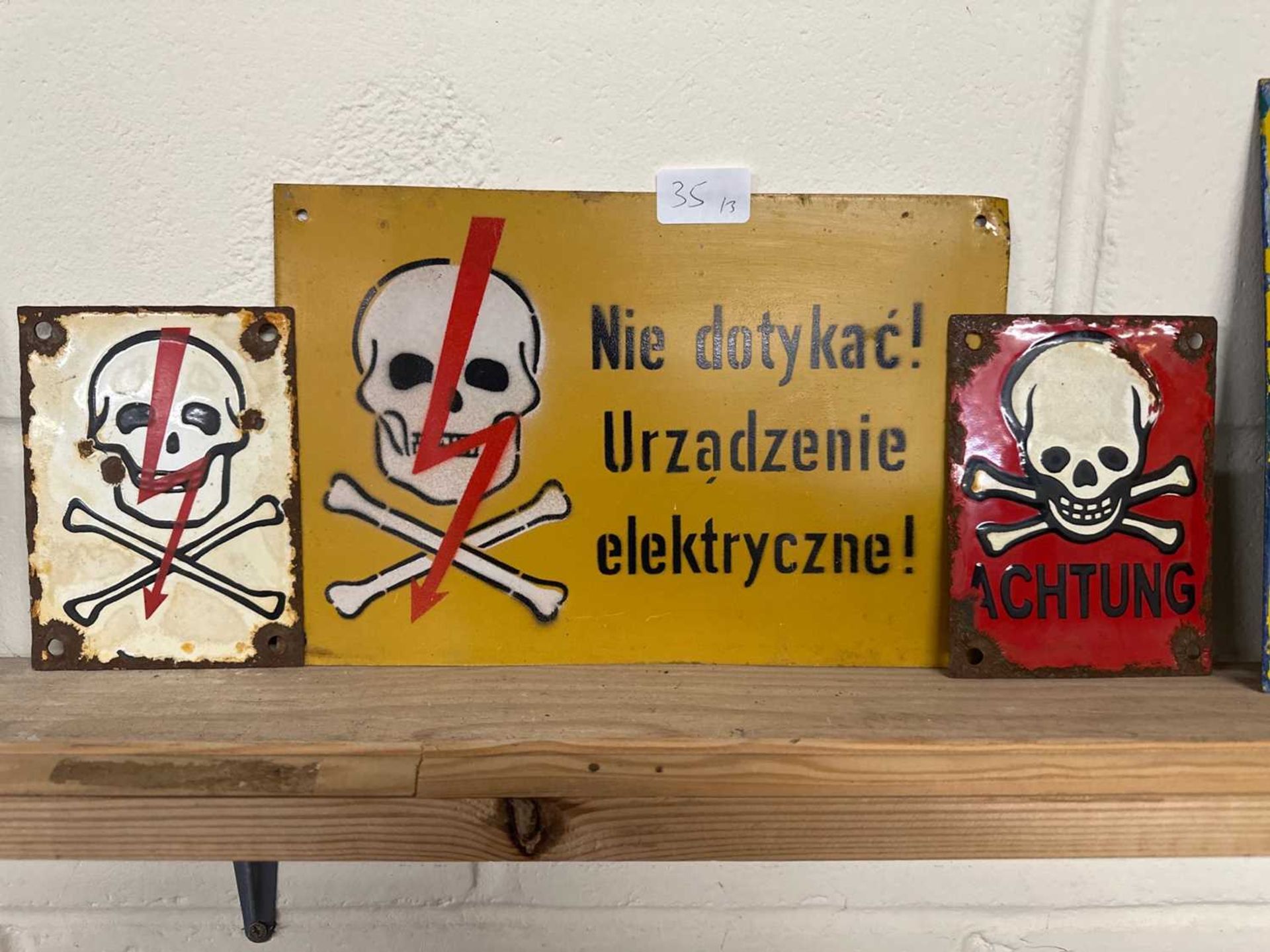 Three various continental "Danger" signs including skull on red background "Achtung"