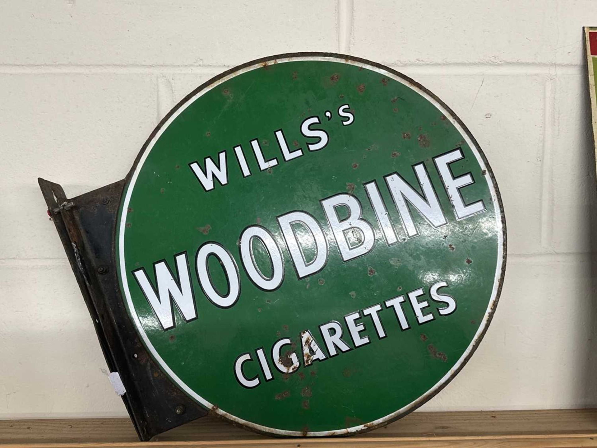 A double sided circular flag-type enamelled sign "Wills's Woodbine Cigarettes"