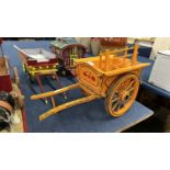 A scratch built model of a single axle hay cart, painted in dark yellow and black, 65cm long in