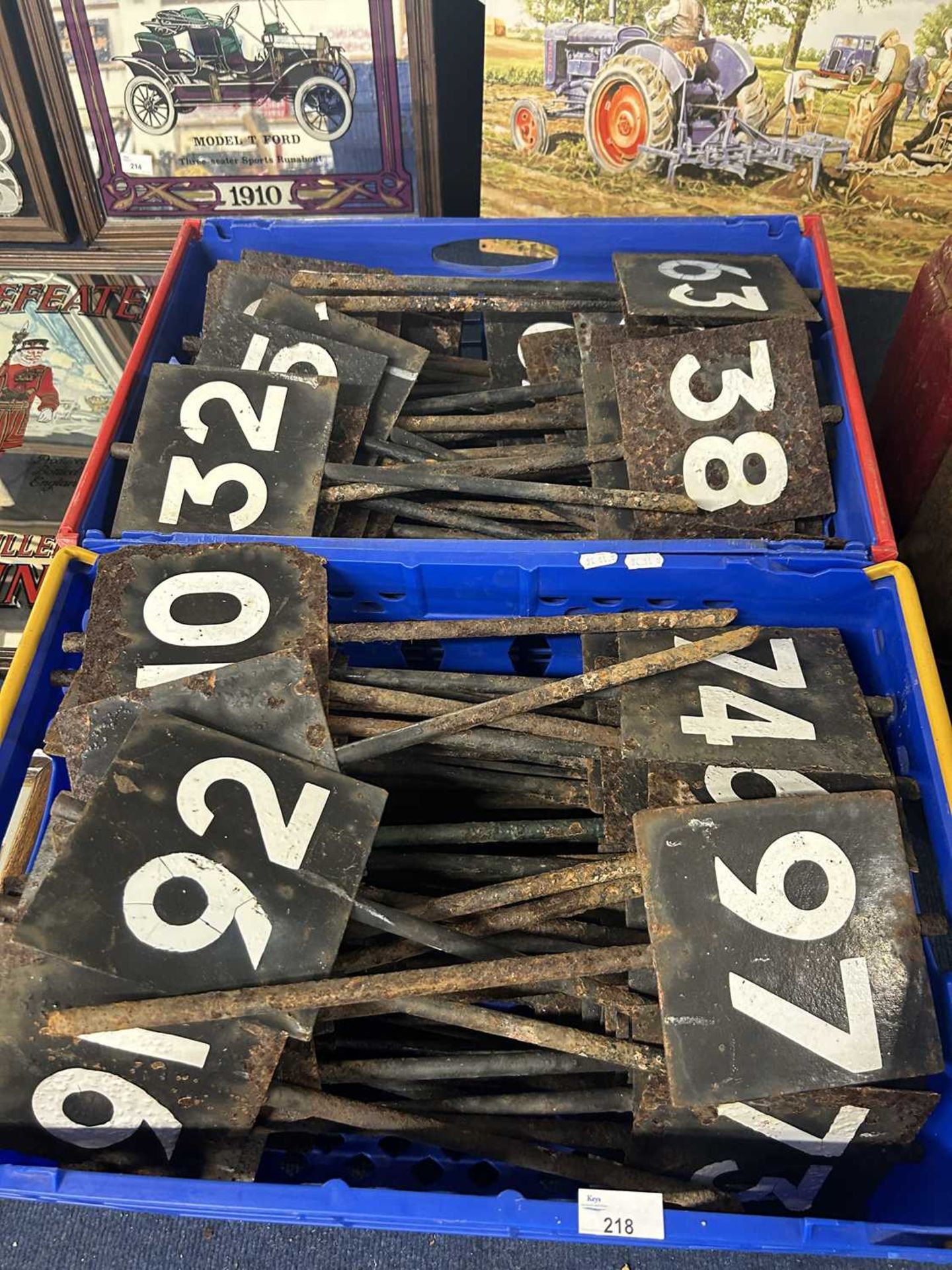 Two boxes of iron row markers with painted numbering