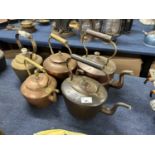 Group of five various copper and brass kettles