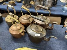 Group of five various copper and brass kettles