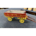 A scratch built model of a double axle low bodied cart, approx 80cm long in total