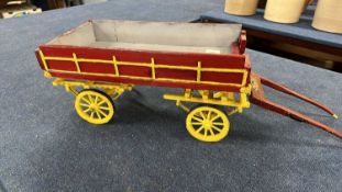 A scratch built model of a double axle low bodied cart, approx 80cm long in total