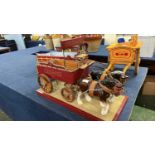 A scratch built model of a brewery dray marked Courage together with two porcelain dray horses