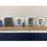 Four etched "Guinness" signs