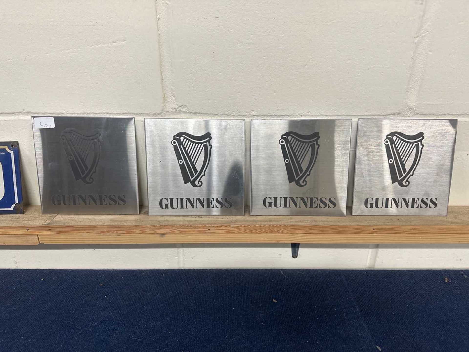 Four etched "Guinness" signs