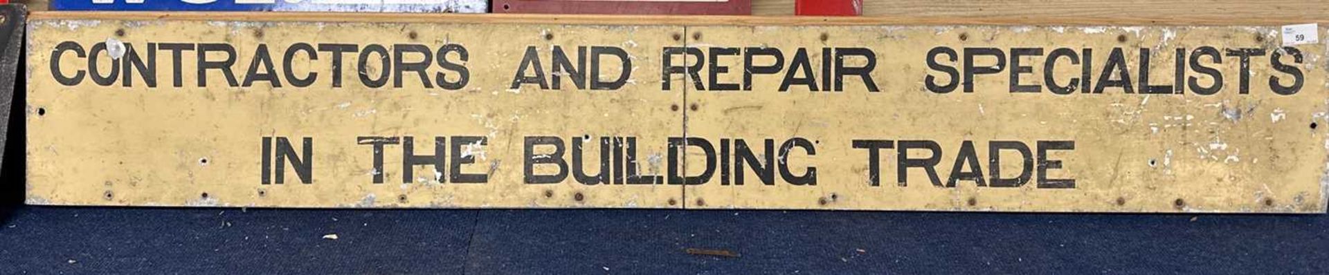Sheet metal sign on wooden back marked Contracts and Repair Specialists in the Building Trade, 141cm