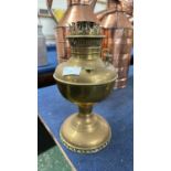 A brass oil lamp base marked Miller