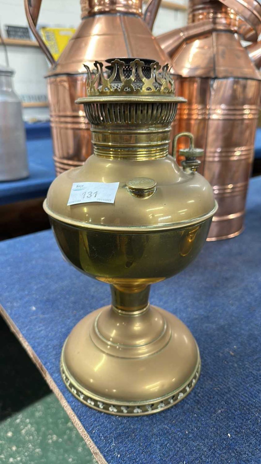 A brass oil lamp base marked Miller