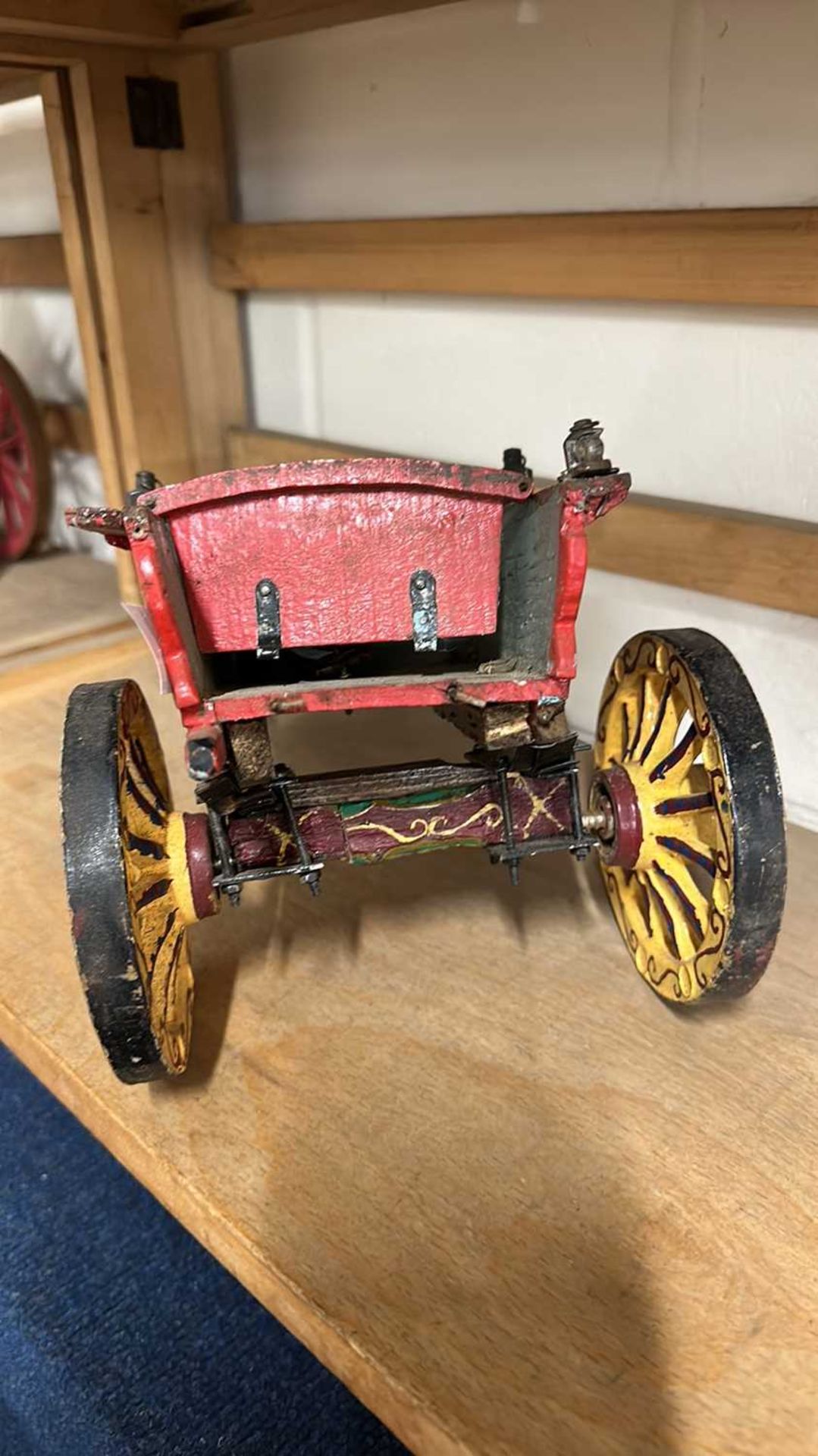 A scratch built model of a small single axle cart, painted in red and yellow, approx 34cm long - Image 4 of 5