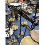 Pair of iron and brass beam scales marked 'W & T Avery, Birmingham'