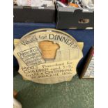 Novelty wooden board with revolving centre marked 'What's for dinner, approved by Guardians of