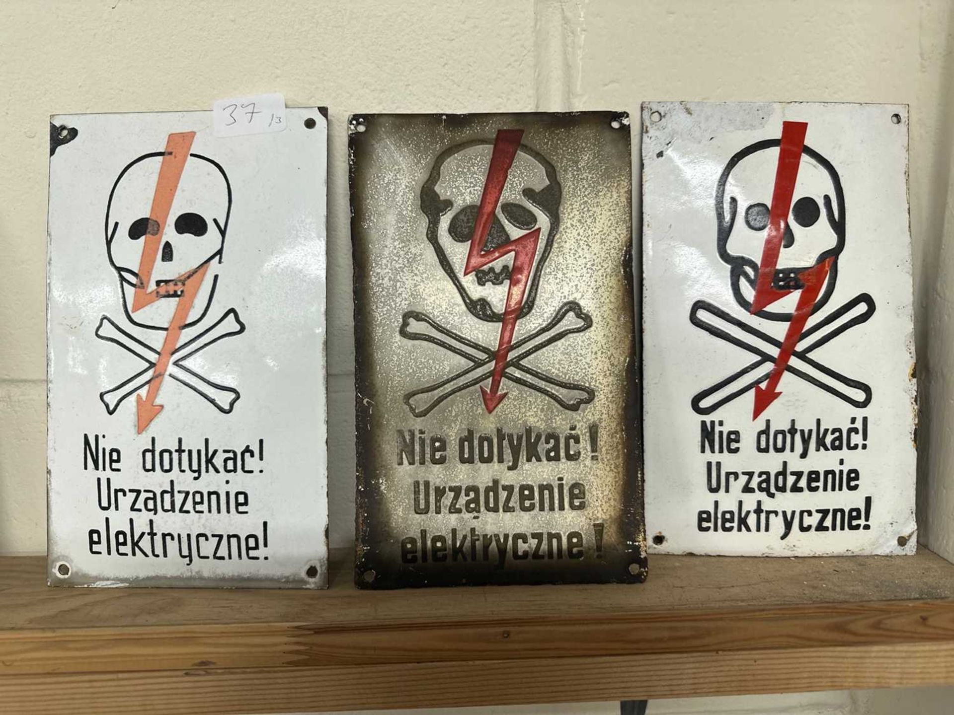 Three Polish electrical danger signs