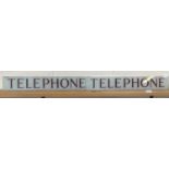 Two glass "Telephone" signs