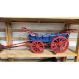 A scratch built model of a Monmouthshire cart, painted in red and blue, approx 75cm long in total