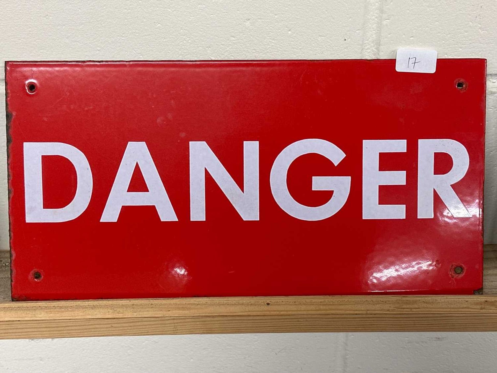 A white on red warning sign "DANGER"
