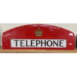 A cast "Telephone" sign from a telephone box