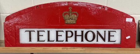 A cast "Telephone" sign from a telephone box