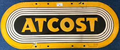 An oval enamel sign marked At Cost, 66cm wide