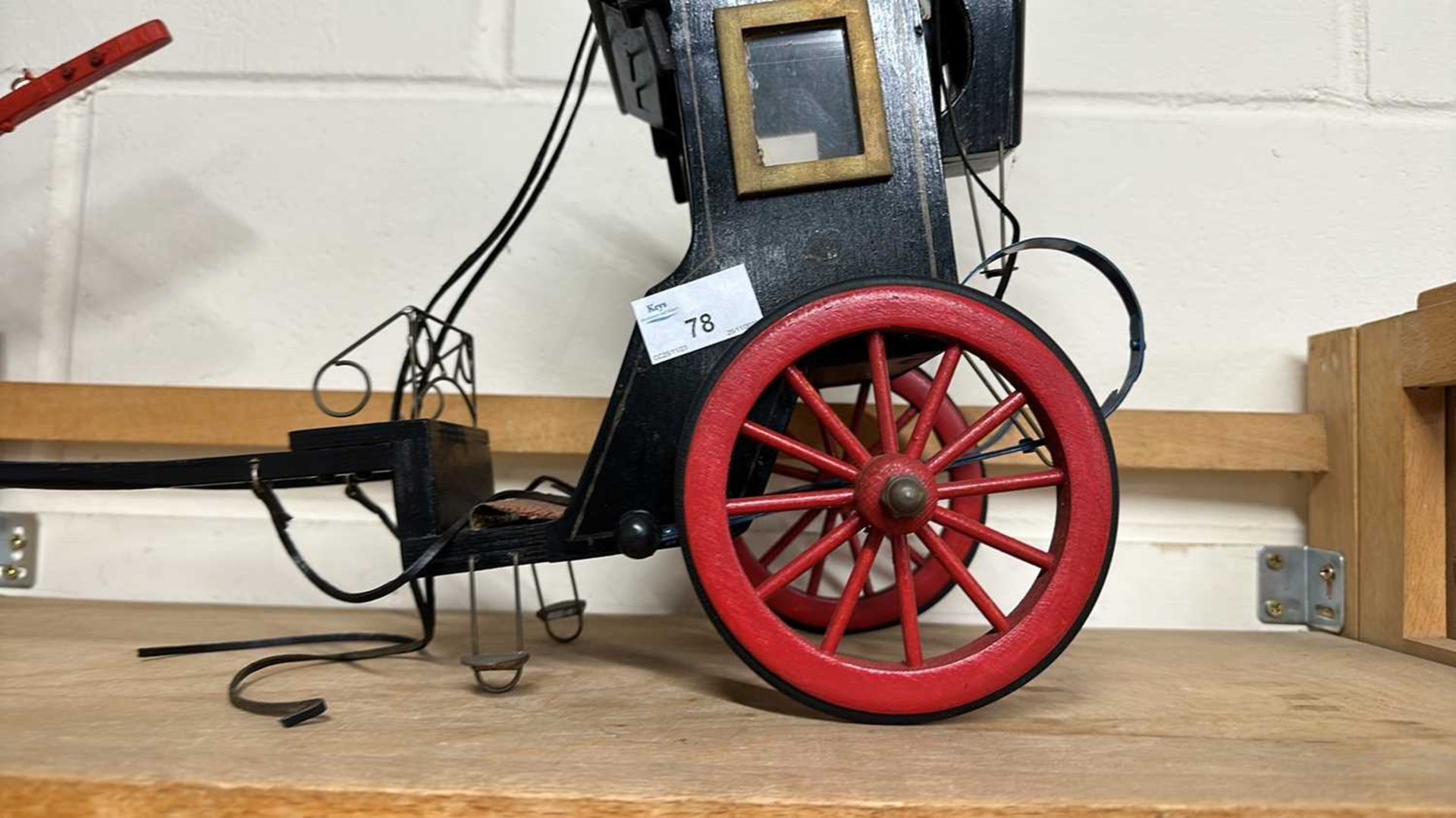 A scratch built model of a Victorian carriage painted in black with red wheels together with a - Image 2 of 9