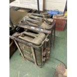 Two vintage jerry cans with transport cages
