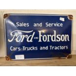 A reproduction enamel sign "Ford & Fordson Cars, Trucks & Tractors"