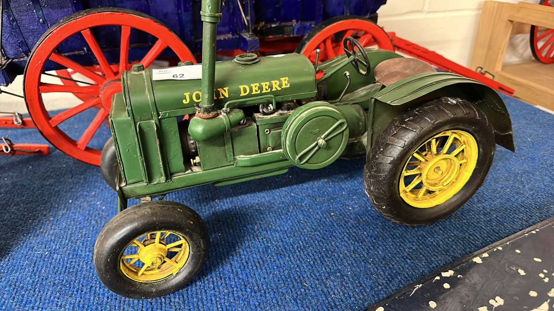 Contemporary metal model of a John Deere tractor, 36cm long