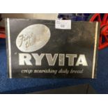 Small sheet metal sign marked Ryvita, 23cm wide