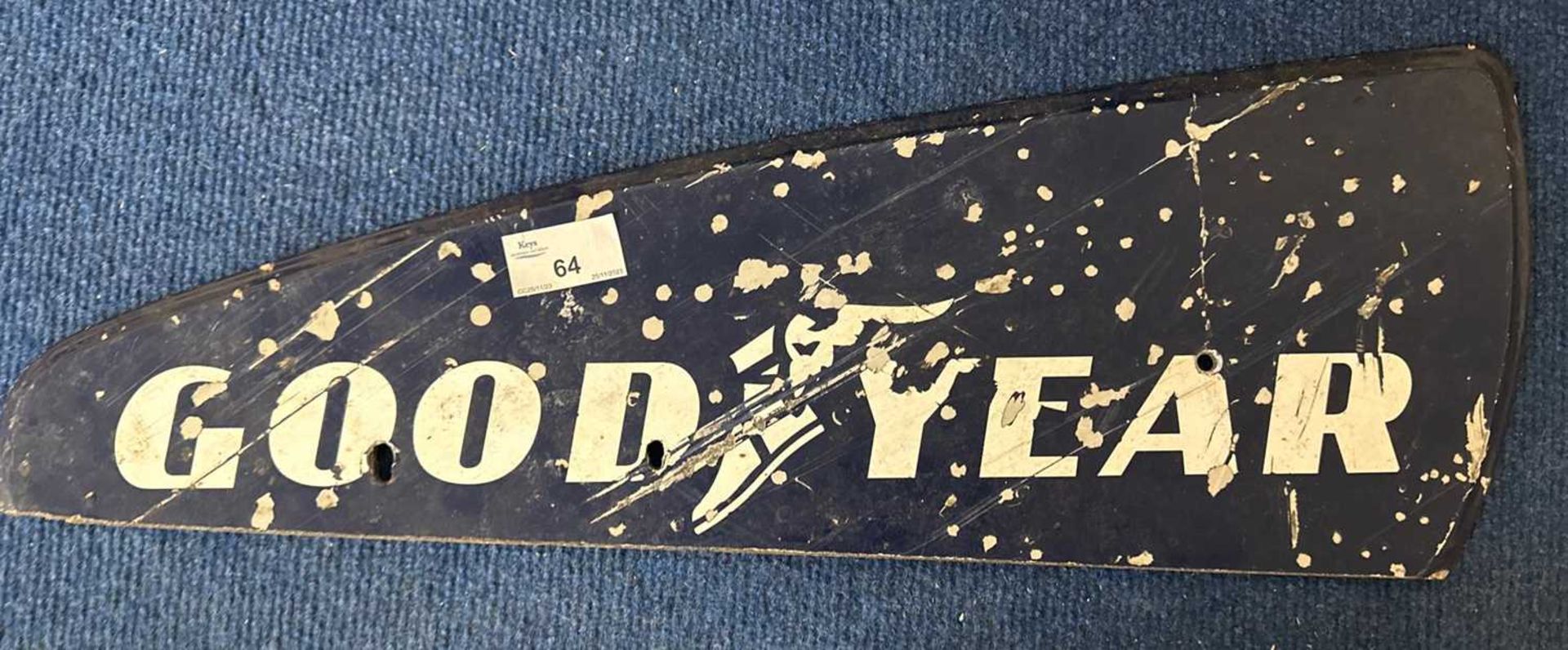A painted plywood sign marked Goodyear, 51cm wide