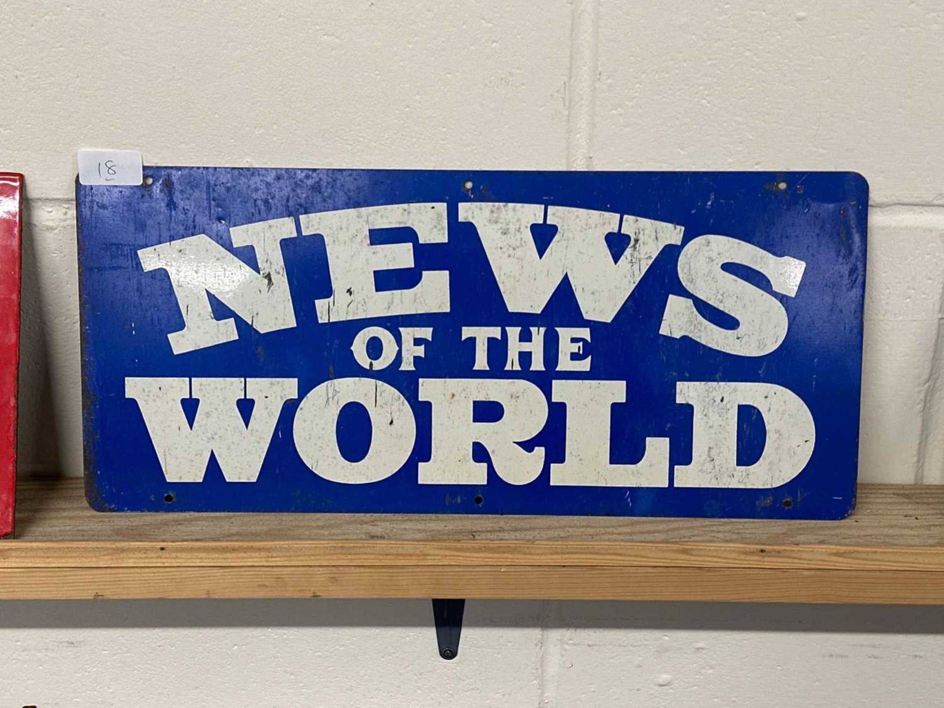 A coloured tin promotional sign "News of the World"