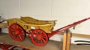 A scratch built model of an Oxford Wagon, painted in beige and red, approx 80cm long in total