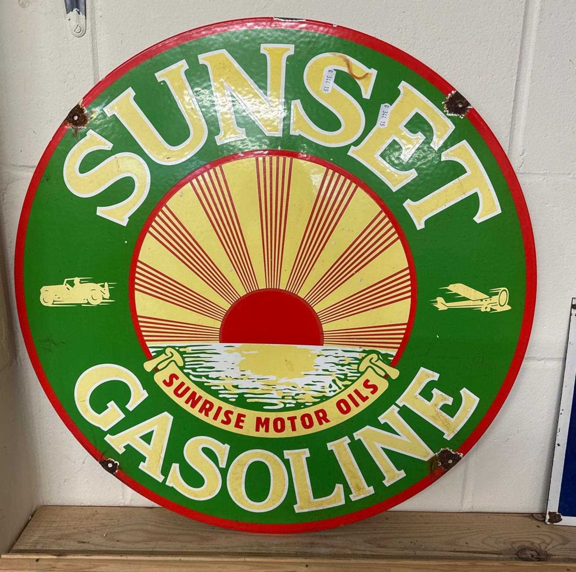 A circular double sided enamel sign "For Sunset Gasoline"