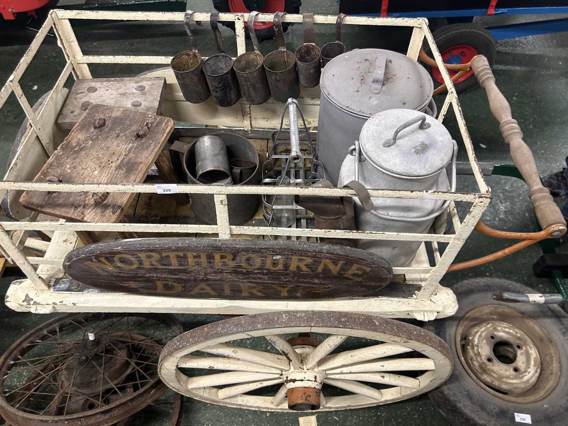 Vintage wood framed three wheel dairy cart bearing plaques for North Bourne Dairy containing a range - Image 2 of 2