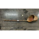 A copper long handled pan