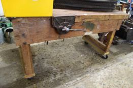 Wooden work bench with vice