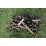 Mixed Lot: Various small iron implement wheels