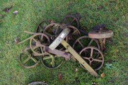 Mixed Lot: Various small iron implement wheels