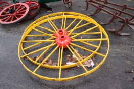 Ransomes, Ipswich, a pair of large red and yellow painted iron wheels, 135cm diameter