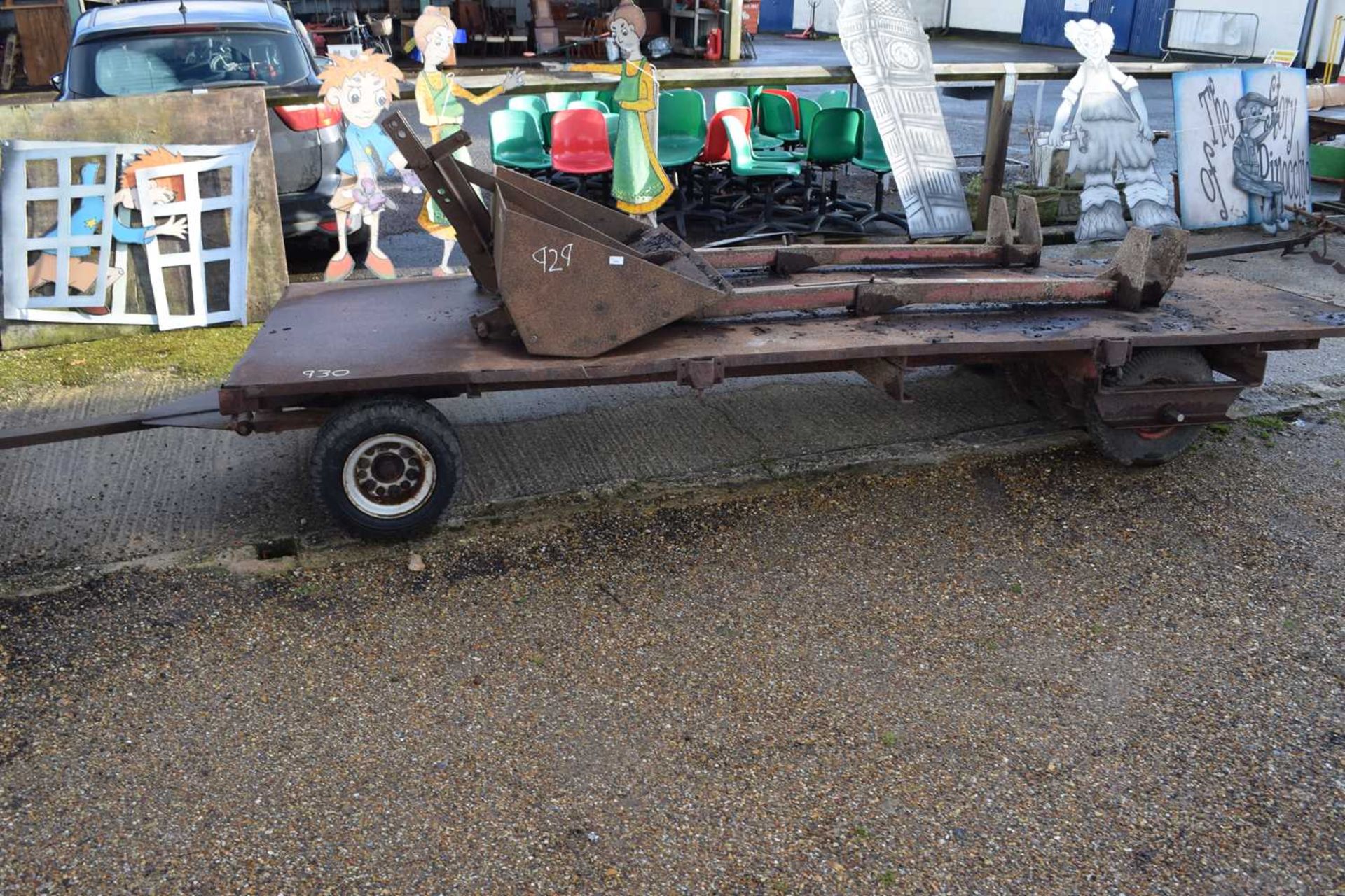 A vintage iron double axle trailer