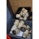 Two boxes of ceramic electric insulators, unbranded