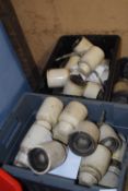 Two boxes of ceramic electric insulators, unbranded