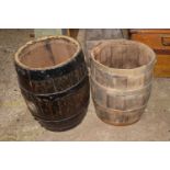 Two metal bound small wooden barrels