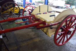 Single axle dairy cart with cream and red painted frame