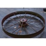 A single iron wheel, 117cm diameter, unpainted