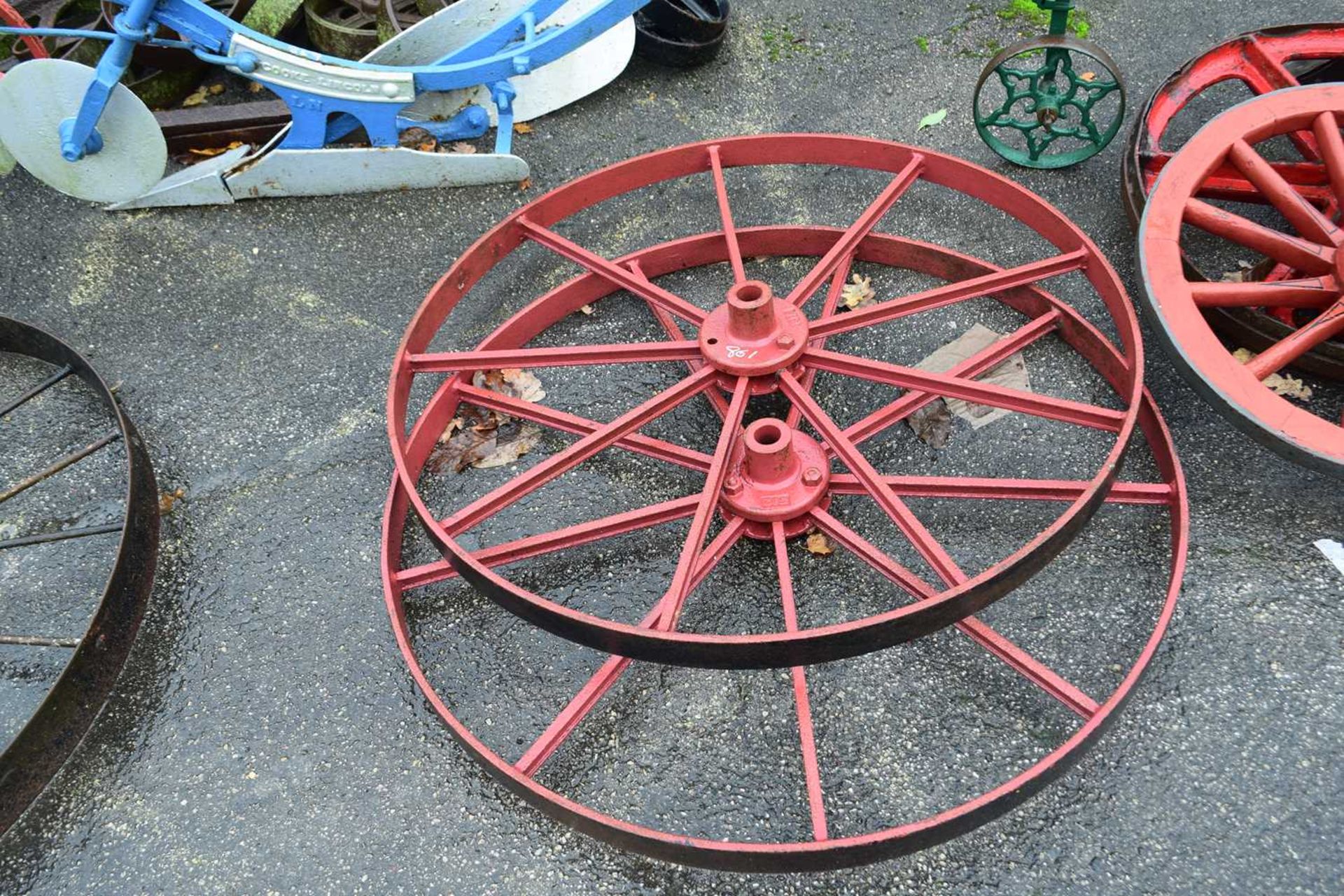 A pair of cast iron wheels marked S12, 107cm diameter