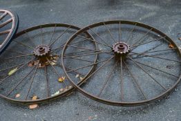 A pair of large cast iron wheels, 132cm diameter