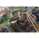 Large Mixed Lot: Various iron wares to include wheels, plough furrows, unbranded tractor seat,