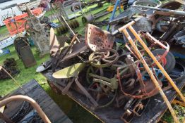 Large Mixed Lot: Various iron wares to include wheels, plough furrows, unbranded tractor seat,