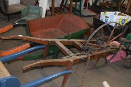 Iron single wheel barrow, probably part of a larger piece